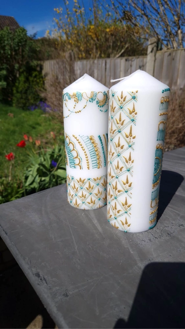 Two custom painted pillar candles