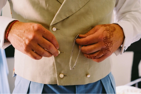 Groom with henna on left hand